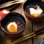 Japanese lacquer bowls containing red bean soup with mochi.
