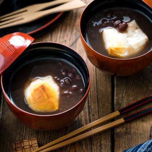 Japanese lacquer bowls containing red bean soup with mochi.