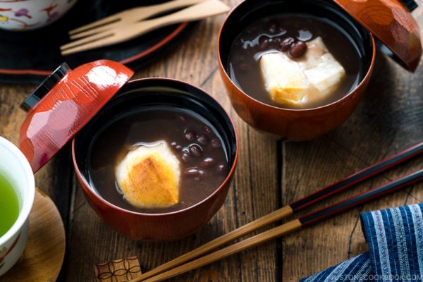 Japanese lacquer bowls containing red bean soup with mochi.