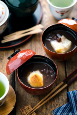 Japanese lacquer bowls containing red bean soup with mochi.