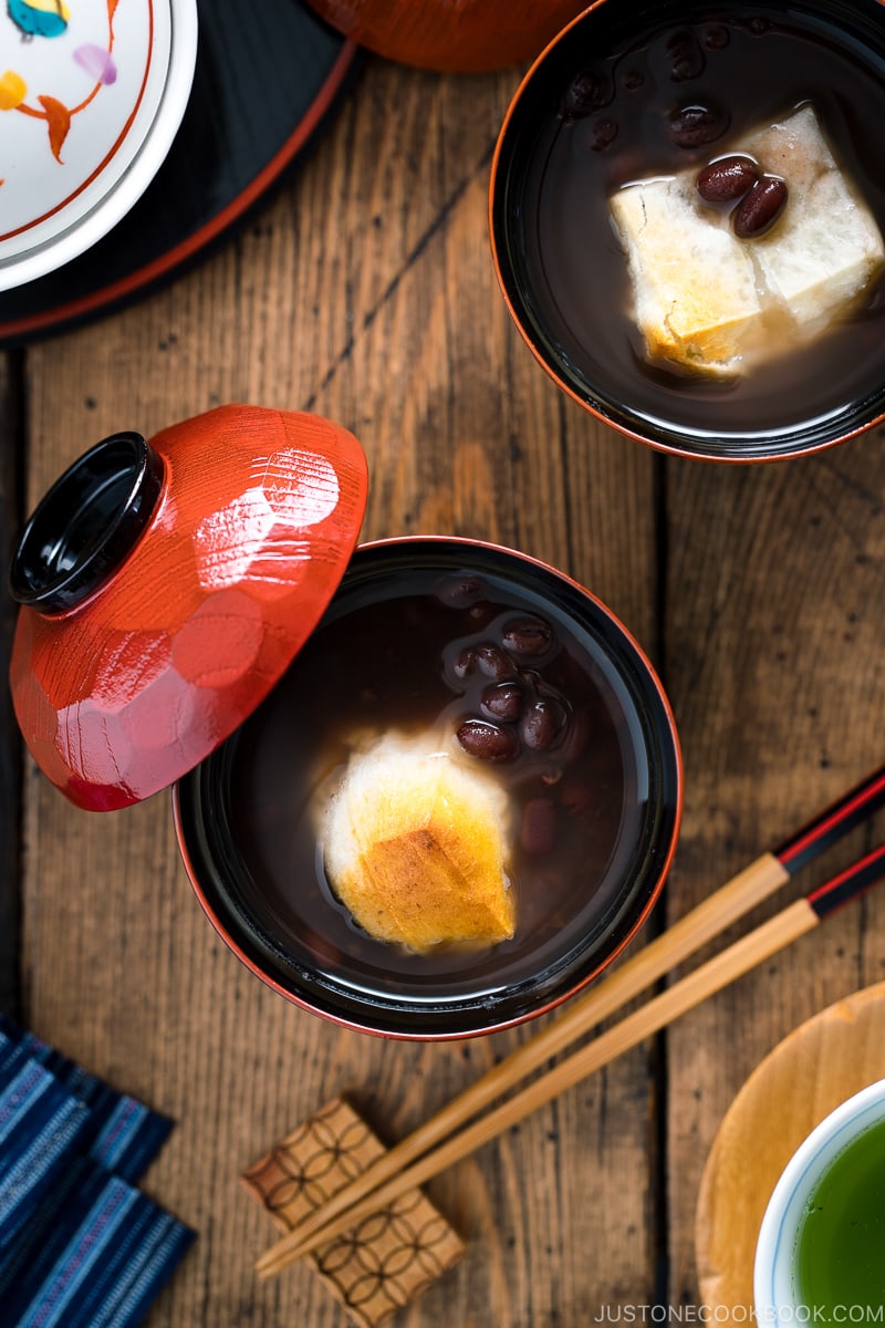 Japanese lacquer bowls containing red bean soup with mochi.