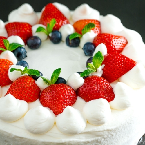 Strawberry shortcake on a cake stand.