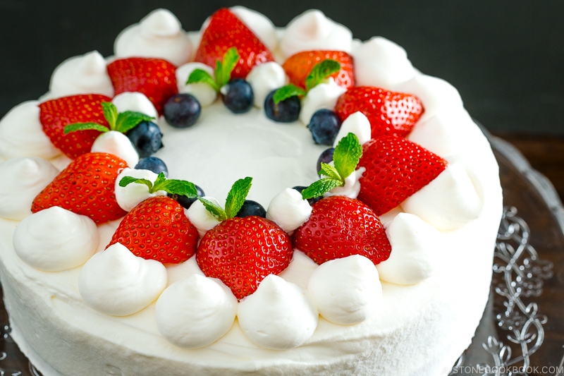Strawberry shortcake on a cake stand.