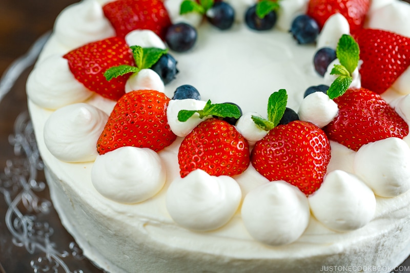 Strawberry shortcake on a cake stand.