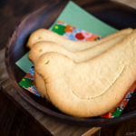 A wooden tray containing a dove-shaped butter cookies (copycat Hato Sabure).