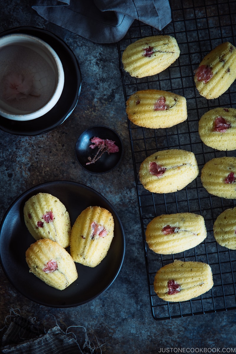 Cherry Blossom Madeleines on a wire rack.