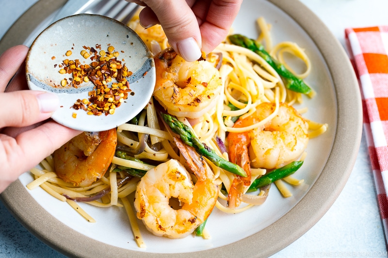 A plate containing Japanese-style Pasta with Shrimp and Asparagus.