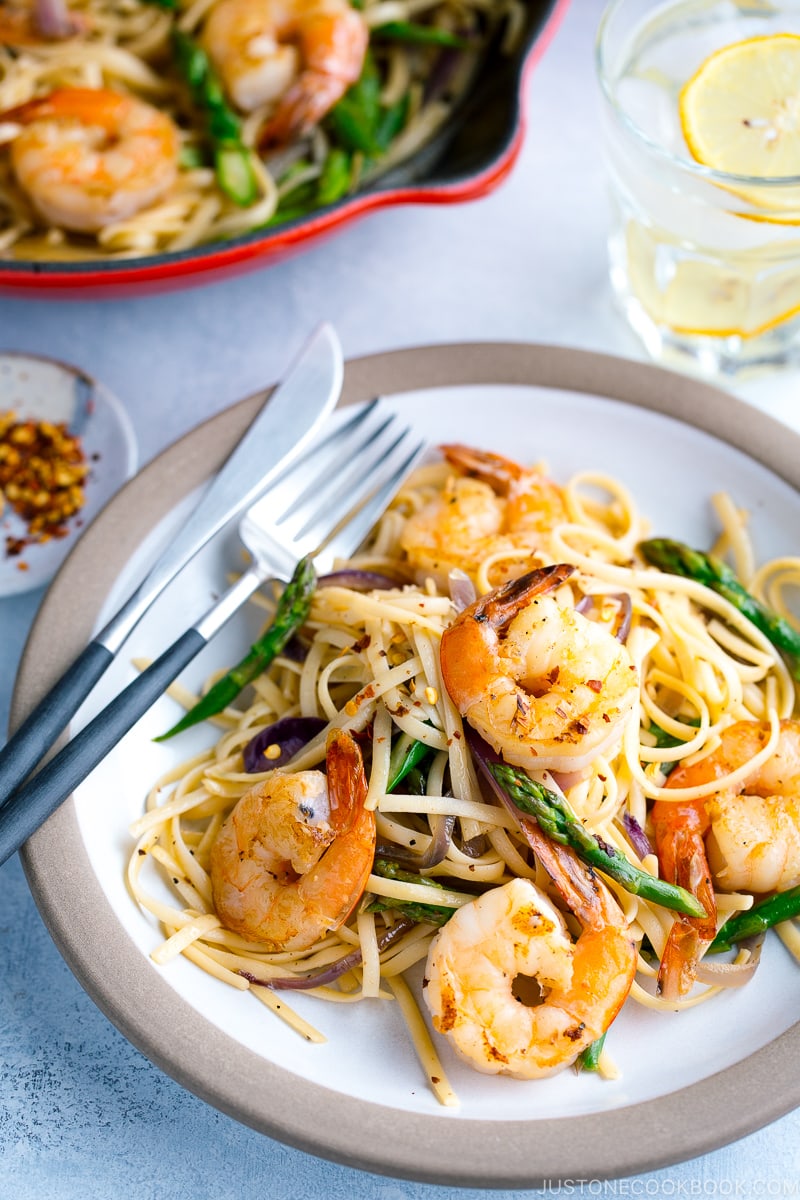 A plate containing Japanese-style Pasta with Shrimp and Asparagus.