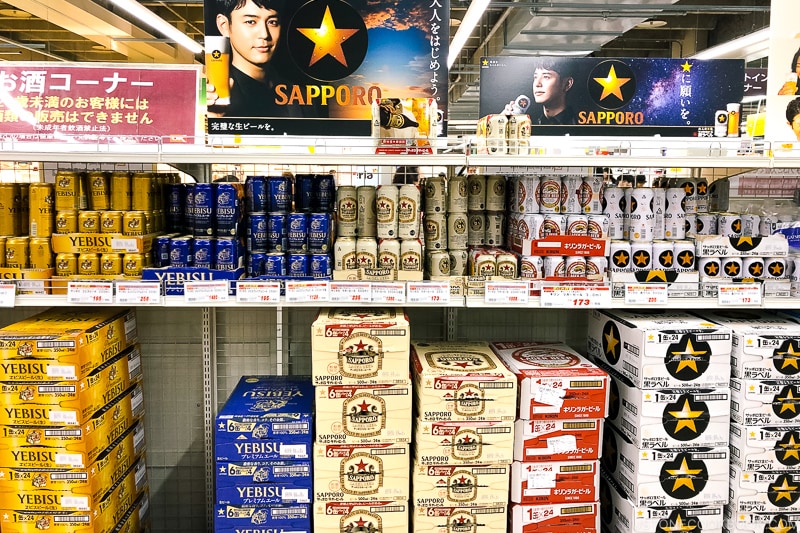 beers on a shelf in a Japanese supermarket