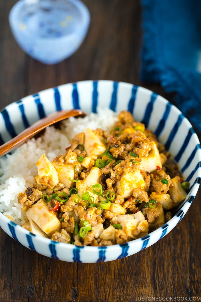 A Japanese blue and white bowl containing Mapo Tofu over steamed rice.