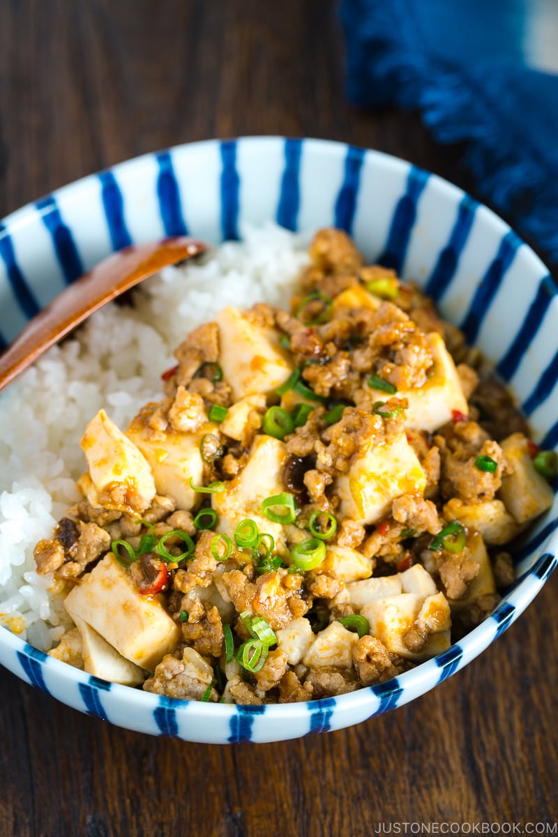 A Japanese blue and white bowl containing Mapo Tofu over steamed rice.