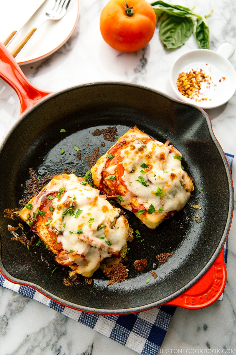 A cast iron skillet containing Tofu Pizza.