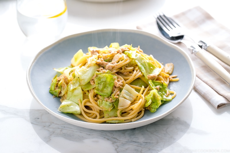 A blue plate containing Japanese-style Tuna and Cabbage Pasta.
