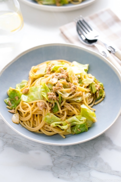 A blue plate containing Japanese-style Tuna and Cabbage Pasta.