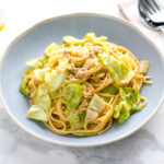 A blue plate containing Japanese-style Tuna and Cabbage Pasta.