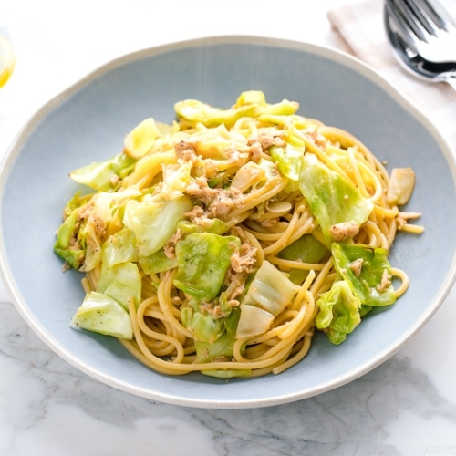 A blue plate containing Japanese-style Tuna and Cabbage Pasta.