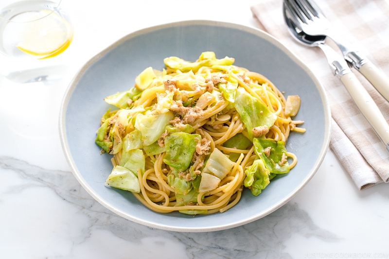 A blue plate containing Japanese-style Tuna and Cabbage Pasta.