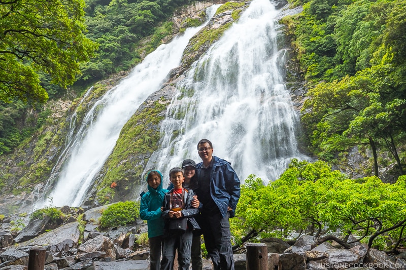family standing in front of Ohko Waterfall - Yakushima Travel Guide | www.justonecookbook.com