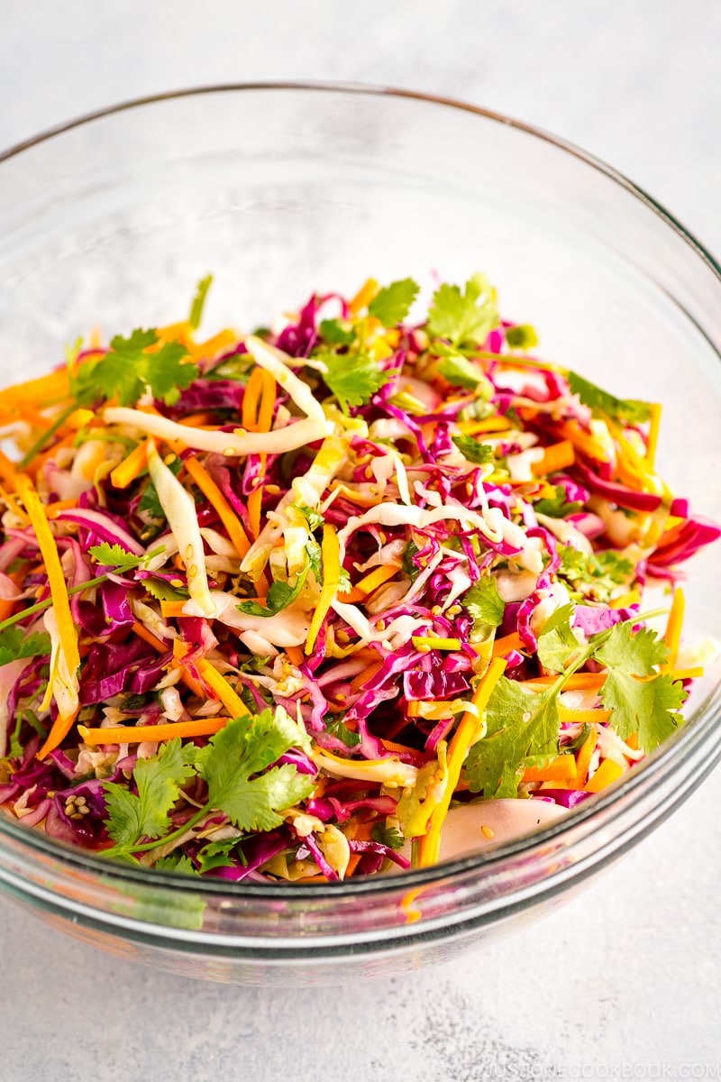 Asian coleslaw in a glass bowl.