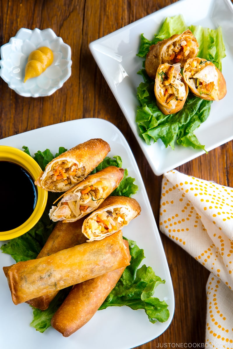 White plates containing Harumaki (Japanese spring roll).