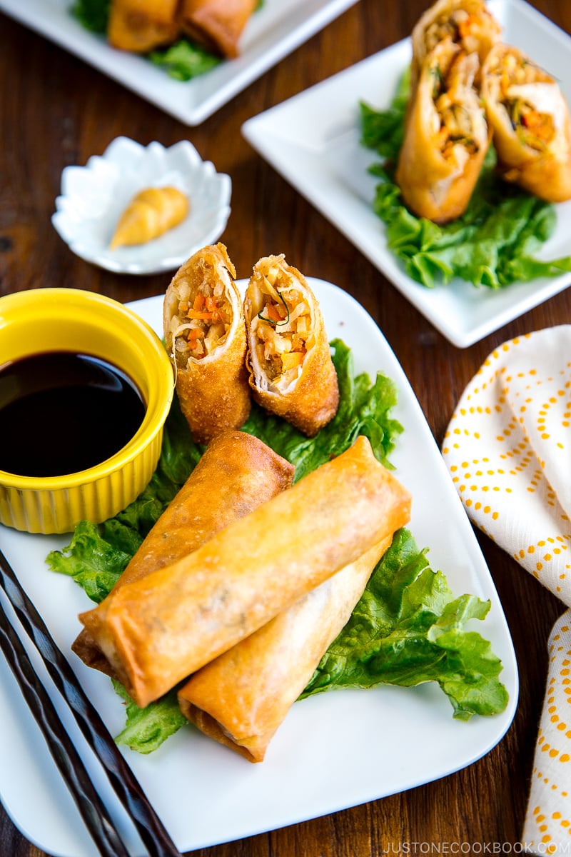 White plates containing Harumaki (Japanese spring roll).