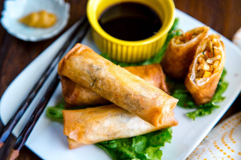 White plates containing Harumaki (Japanese spring roll).