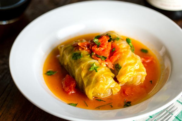 White bowl containing Japanese-style stuffed cabbage rolls.