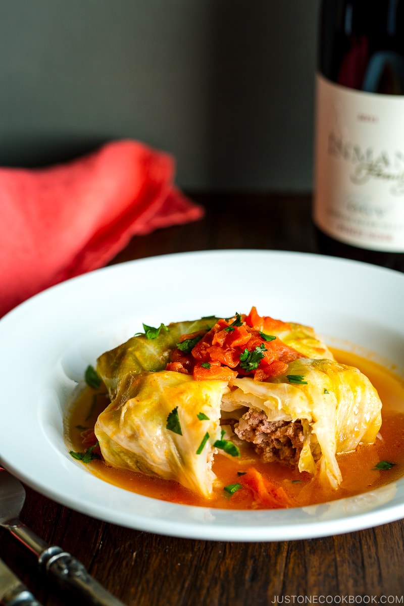 White bowl containing Japanese-style stuffed cabbage rolls.