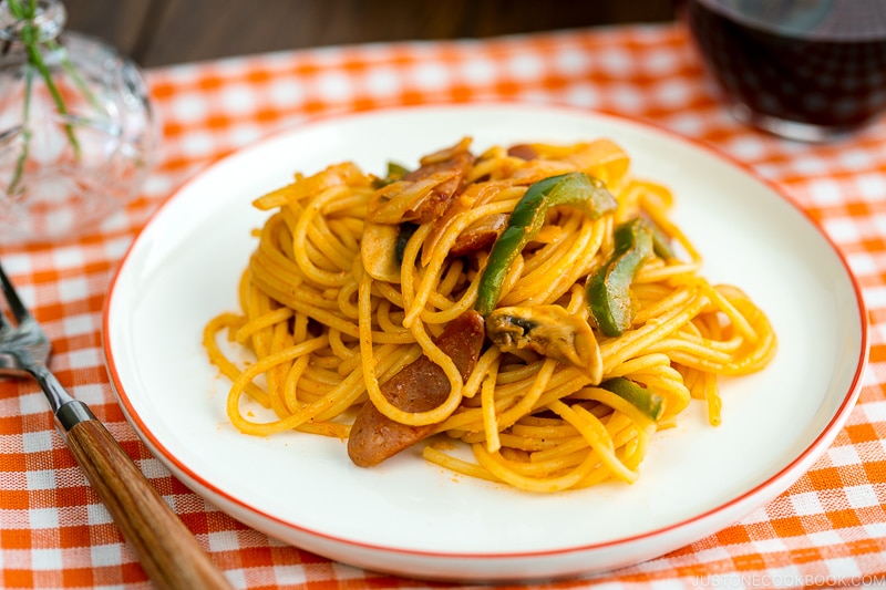 A white plate containing Japanese Ketchup Spaghetti (Napolitan).