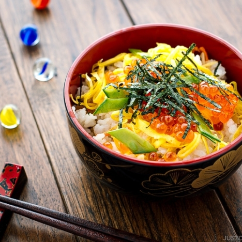 A Japanese-style bowl containing colorful Chirashi Sushi.