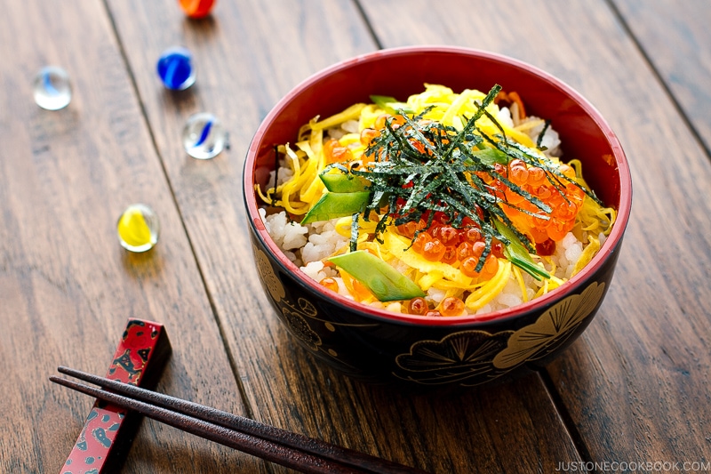 A Japanese-style bowl containing colorful Chirashi Sushi.