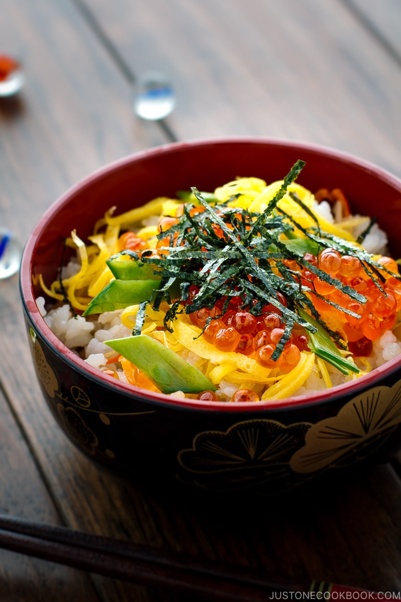 A Japanese-style bowl containing colorful Chirashi Sushi.