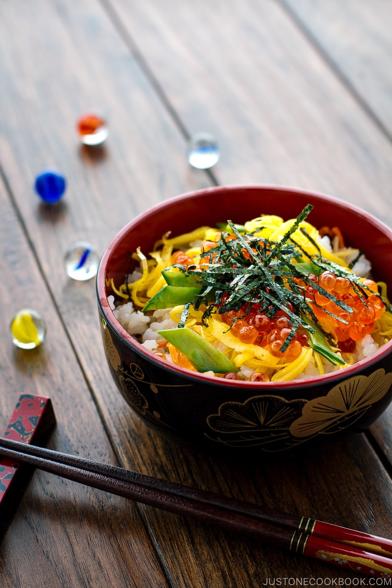 A Japanese-style bowl containing colorful Chirashi Sushi.