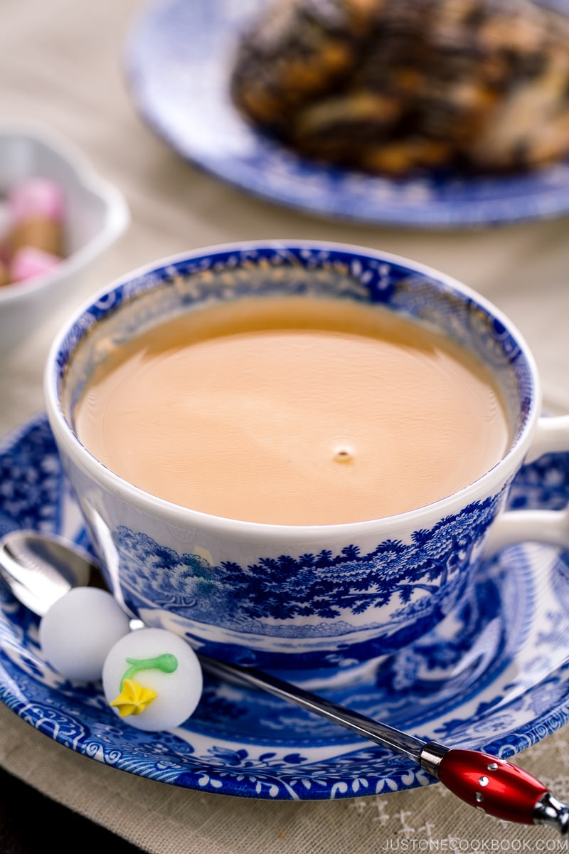 Royal milk tea in a blue and white tea cup.