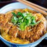 A donburi bowl containing baked katsudon.