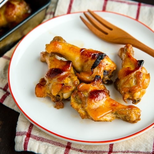 A white plate containing Honey Soy Chicken Wings