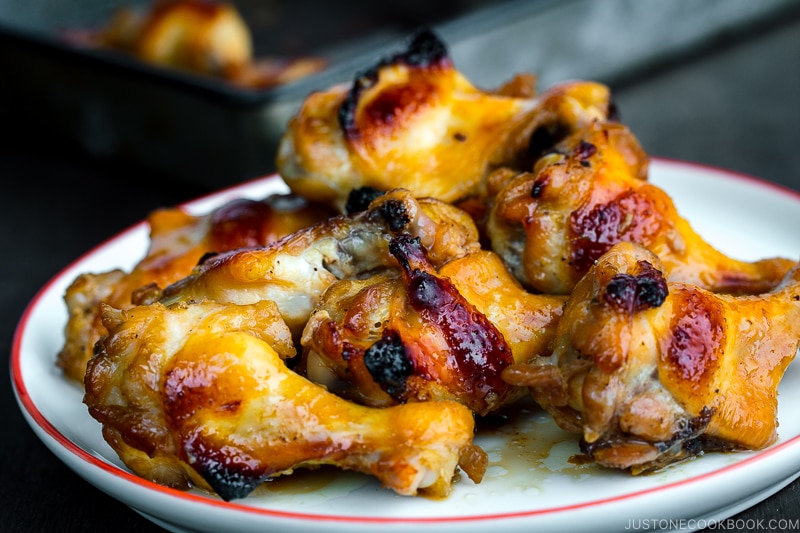 A white plate containing Honey Soy Chicken Wings