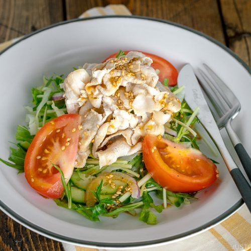 A white dish containing Shabu Shabu Salad.