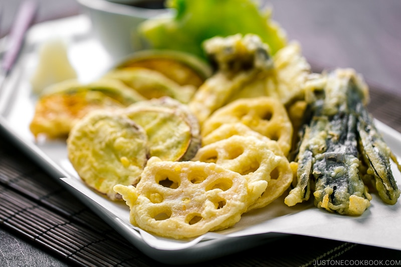 A plate containing assorted vegetable tempura.