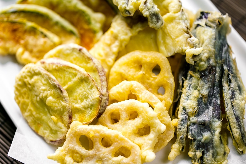 A plate containing assorted vegetable tempura.