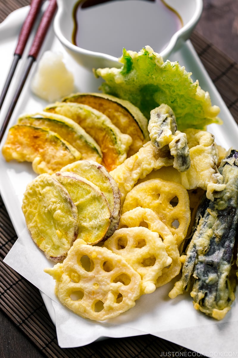 A plate containing assorted vegetable tempura.
