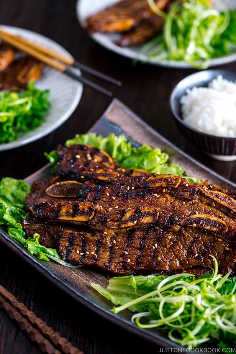 Plates containing Korean-style marinated bbq ribs.