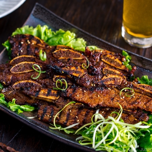 Plates containing Korean-style marinated bbq ribs.