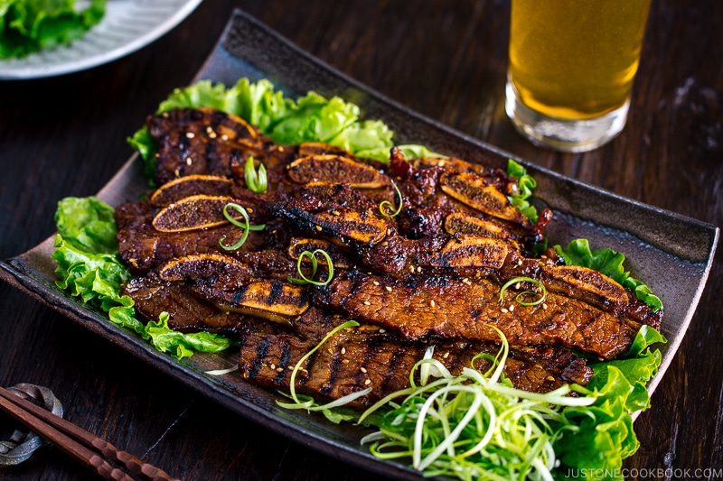 Plates containing Korean-style marinated bbq ribs.