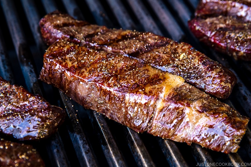 steak grilling on a grill