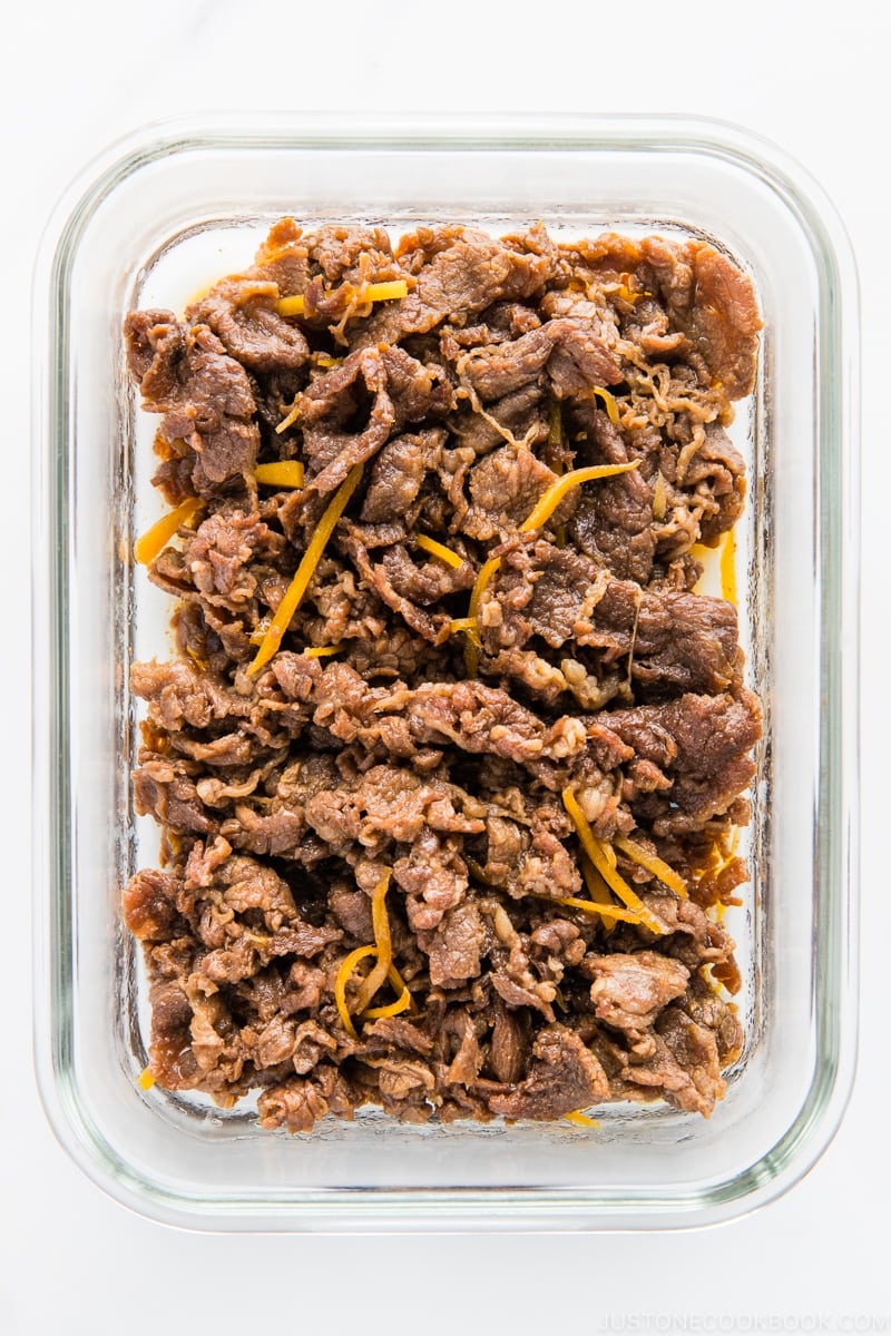 A glass container filled Simmered Beef with Ginger (Shigureni)