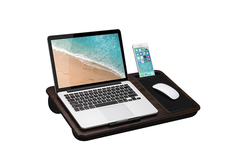 lap desk with a laptop, phone, and mouse