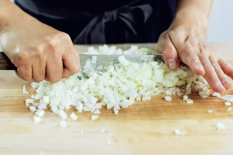 Mincing the onion.