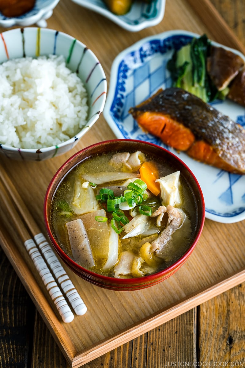 Tonjiru (Pork and Vegetable Soup) served with grilled salmon, steamed rice, and vegetable side dishes.