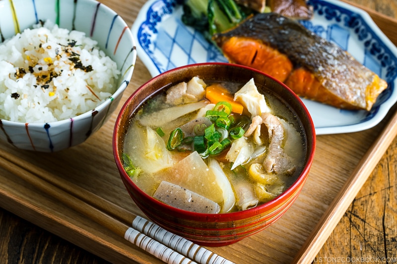 Tonjiru (Pork and Vegetable Soup) served with grilled salmon, steamed rice, and vegetable side dishes.